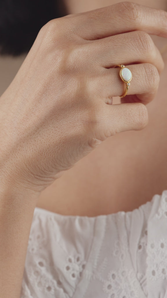 Model wearing various Eterica jewelry pieces